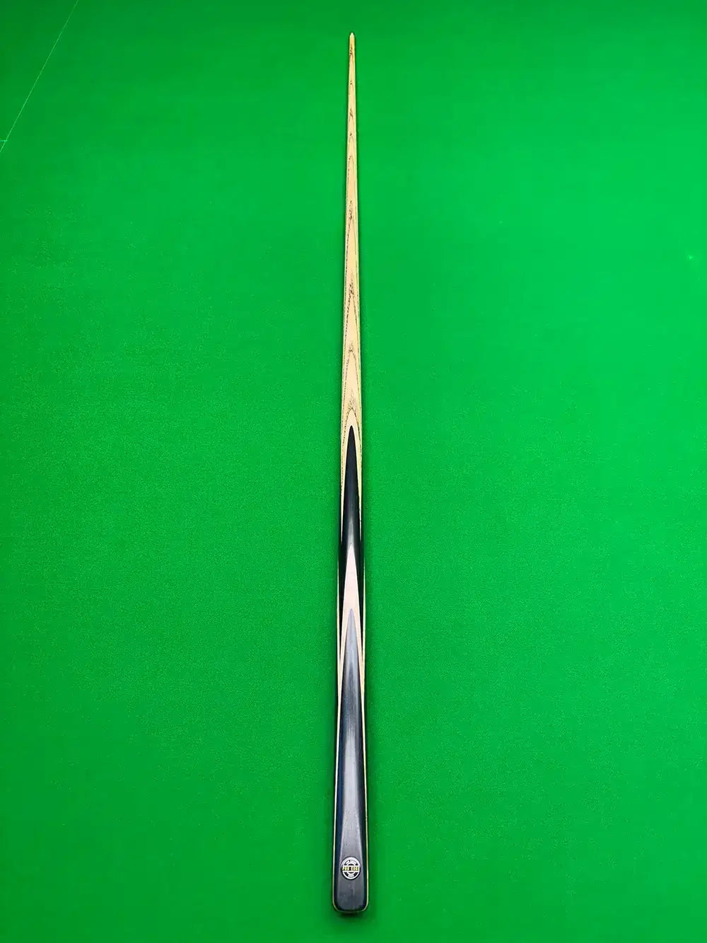 Snooker cue on a green background