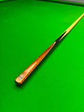 Pro Edge snooker cue on a green snooker table