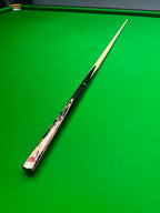snooker cue on a snooker table