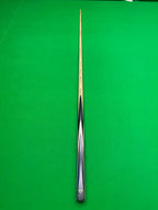 snooker cue on a snooker table