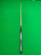 snooker cue on a snooker table