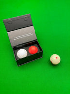 the balls by chris henry and a spotted cue ball on a snooker table