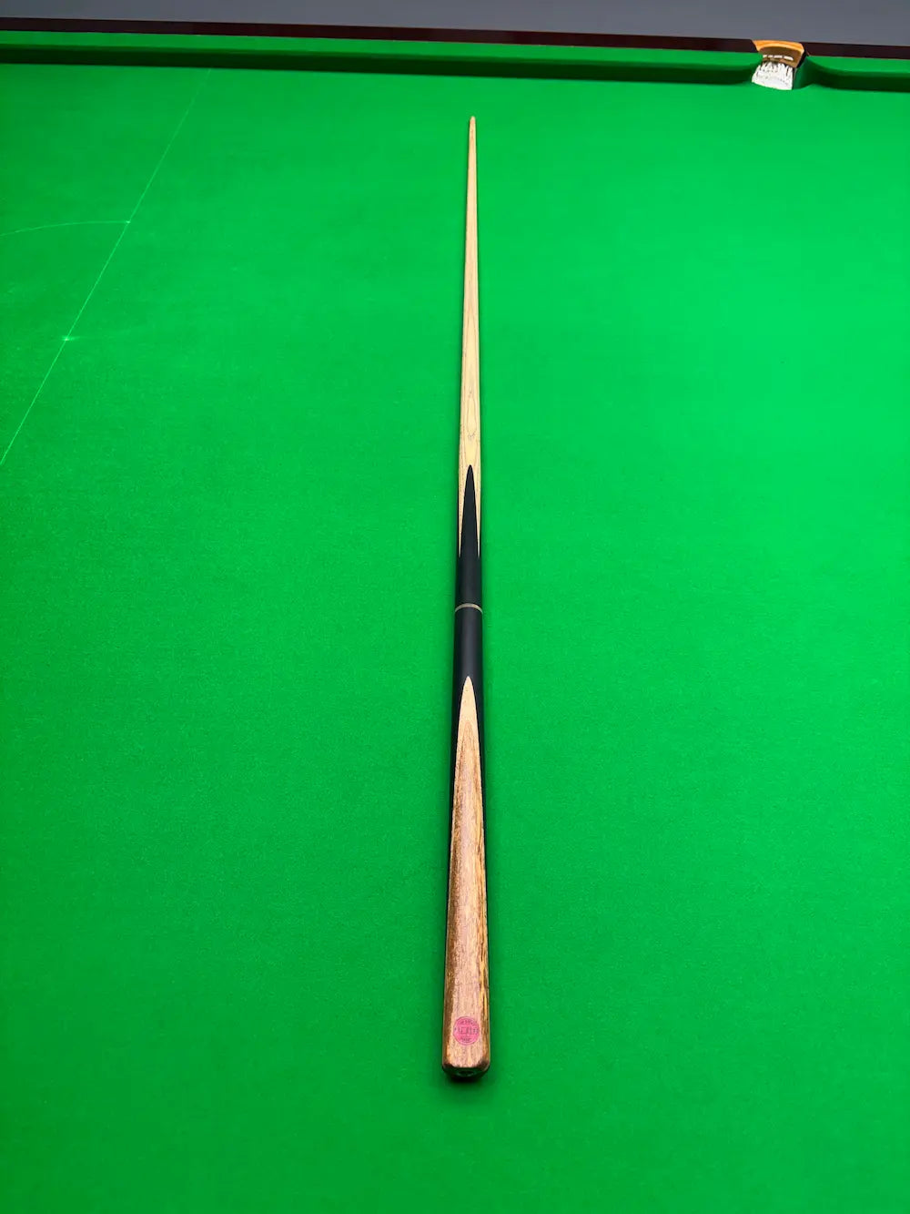 Ash snooker cue by Pro Edge Snooker on a snooker table