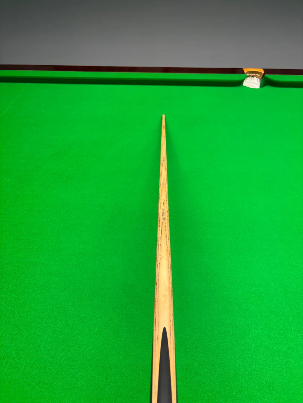 Pro Edge Shadow snooker cue on a green cloth snooker table