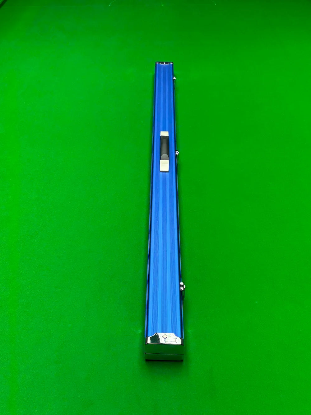 Blue snooker cue case on a green snooker table