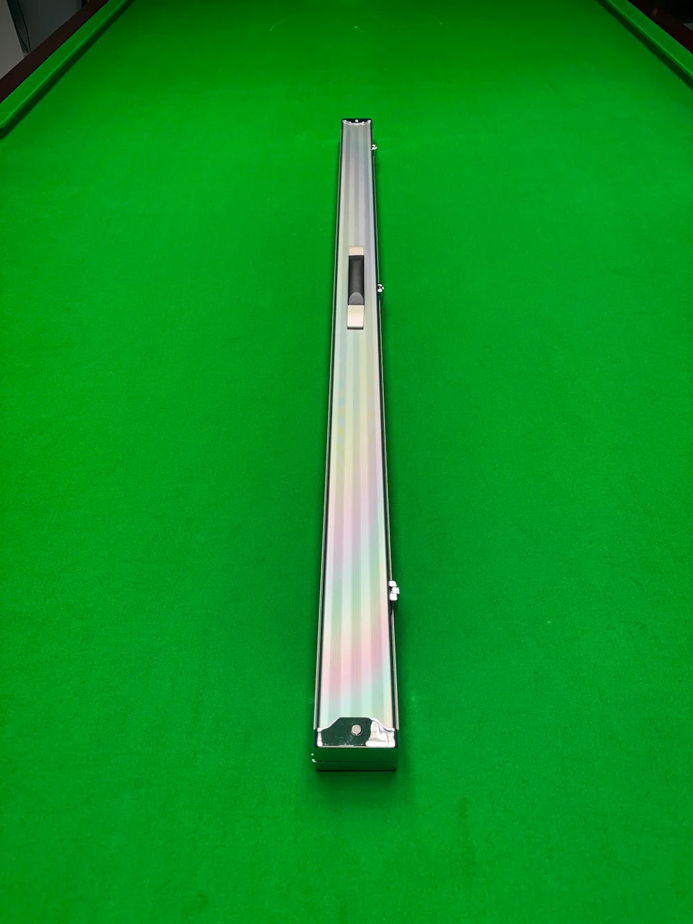 Silver snooker cue case on a snooker  table