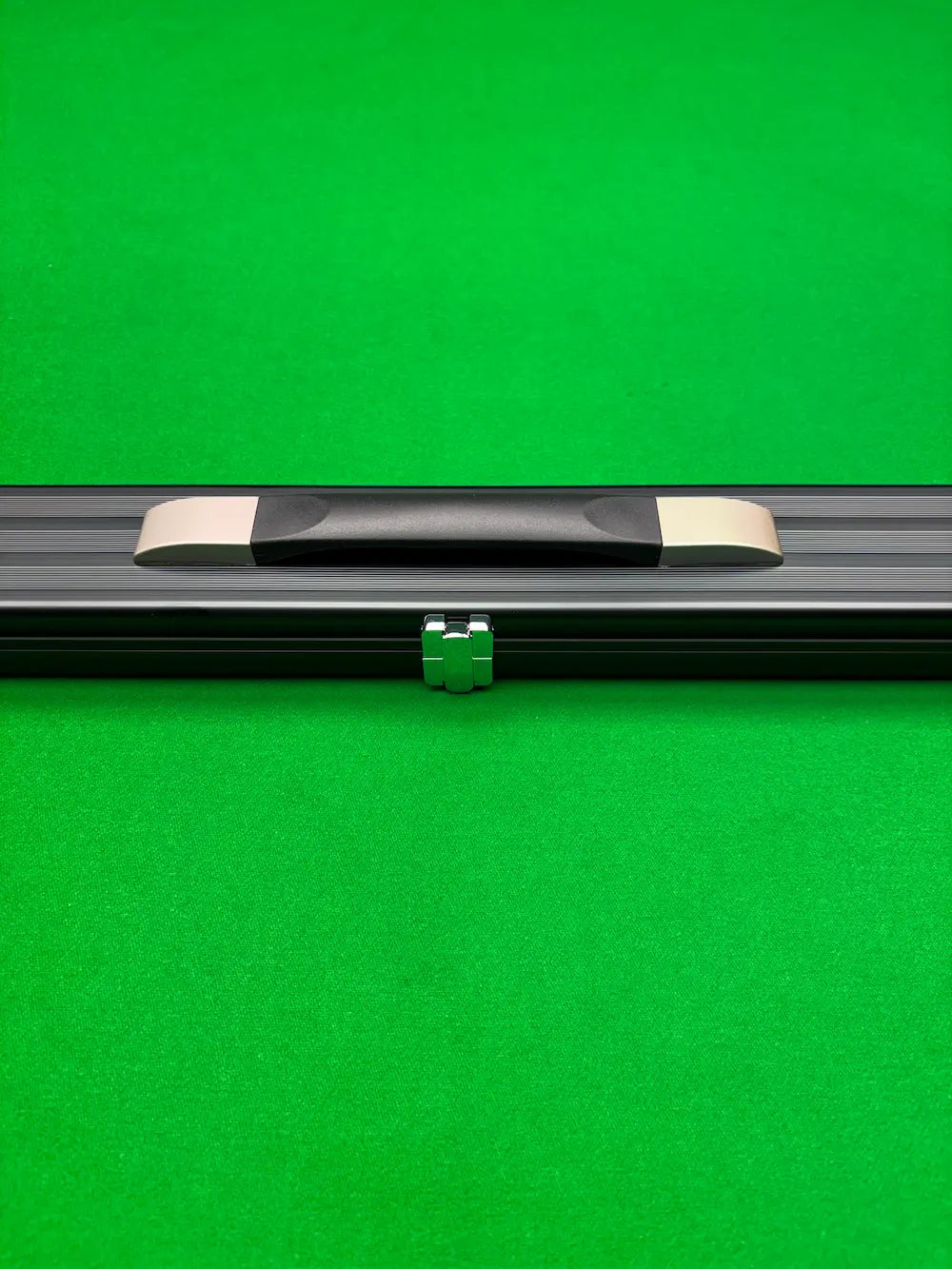 Snooker cue case on a snooker table