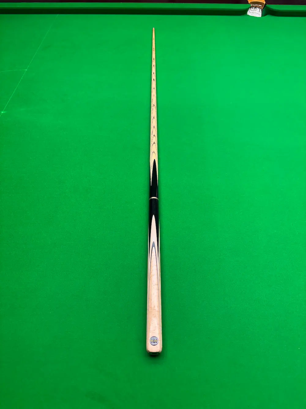 high-quality snooker cue on a green surface