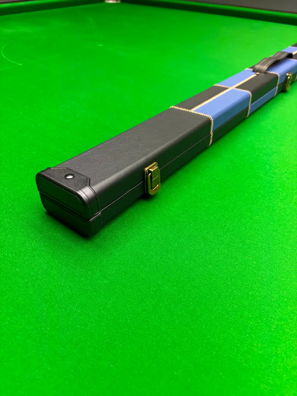 Snooker cue case on a green snooker table