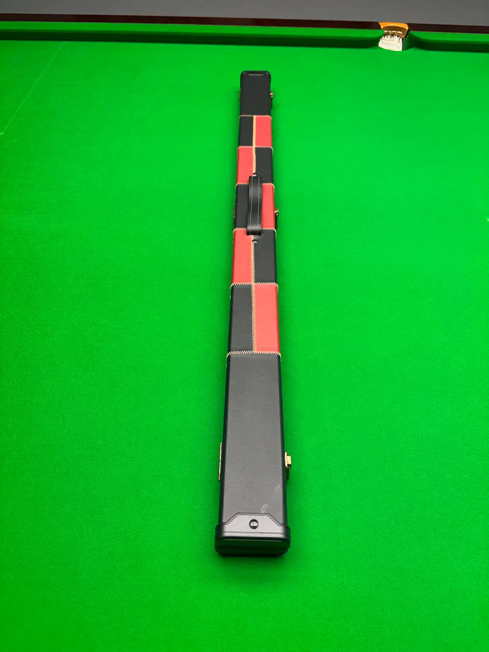 black and red faux leather cue case