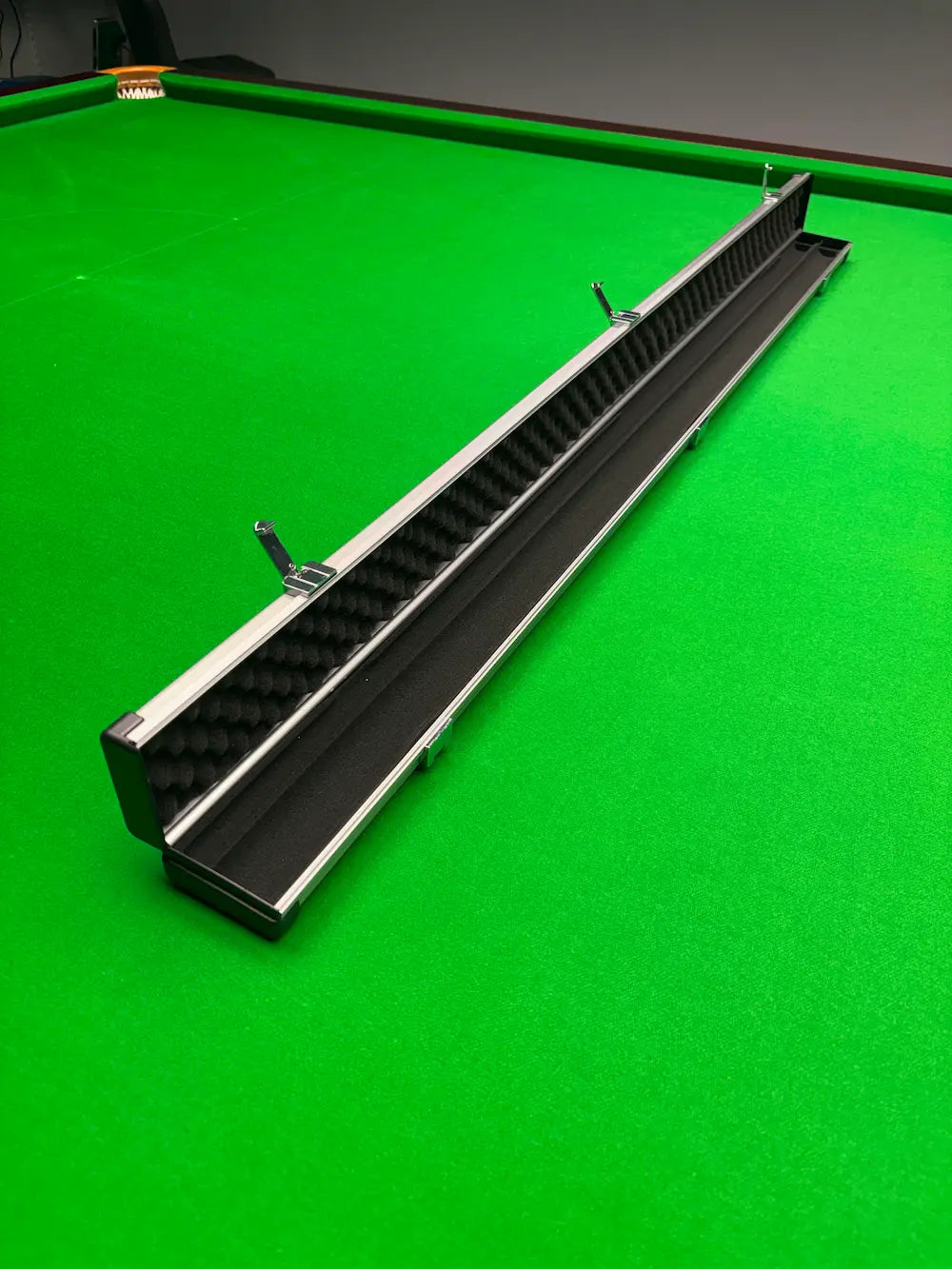 aluminum cue case in a snooker room