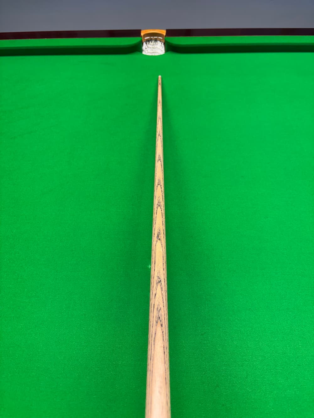 pro edge ash snooker cue on a snooker table