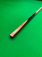 Ebony and Orange Padauk snooker cue on a snooker table by pro edge snooker