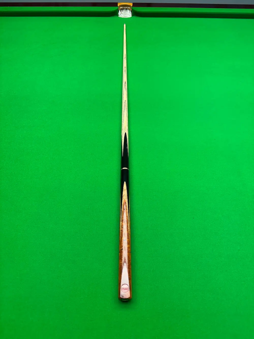 3/4 snooker cue on a snooker table Ebony, Makha Burl and Bungor Burl by pro edge snooker