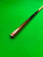 3/4 snooker cue with an Ebony and Lava Rosewood butt on a green snooker table