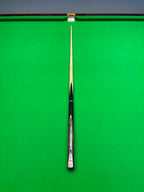 exotic wood snooker cue on a snooker table
