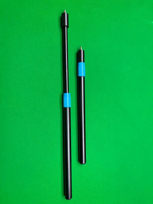 two cue extensions on a snooker table