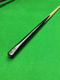 Snooker cue on a green snooker table 