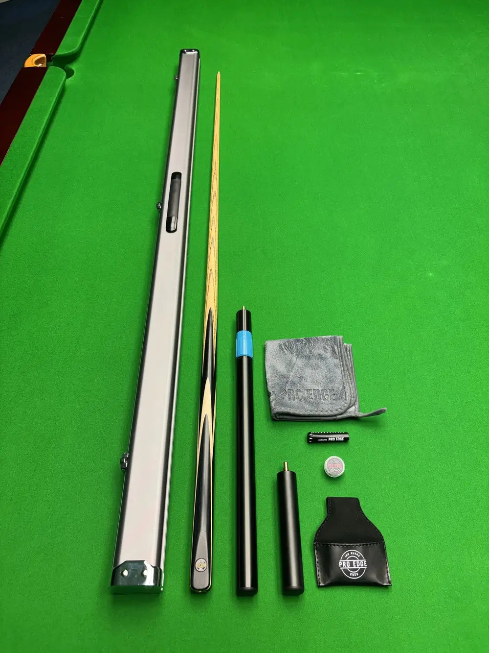 Pro Edge Ash Snooker Cue and Snooker Accessories On a green table 