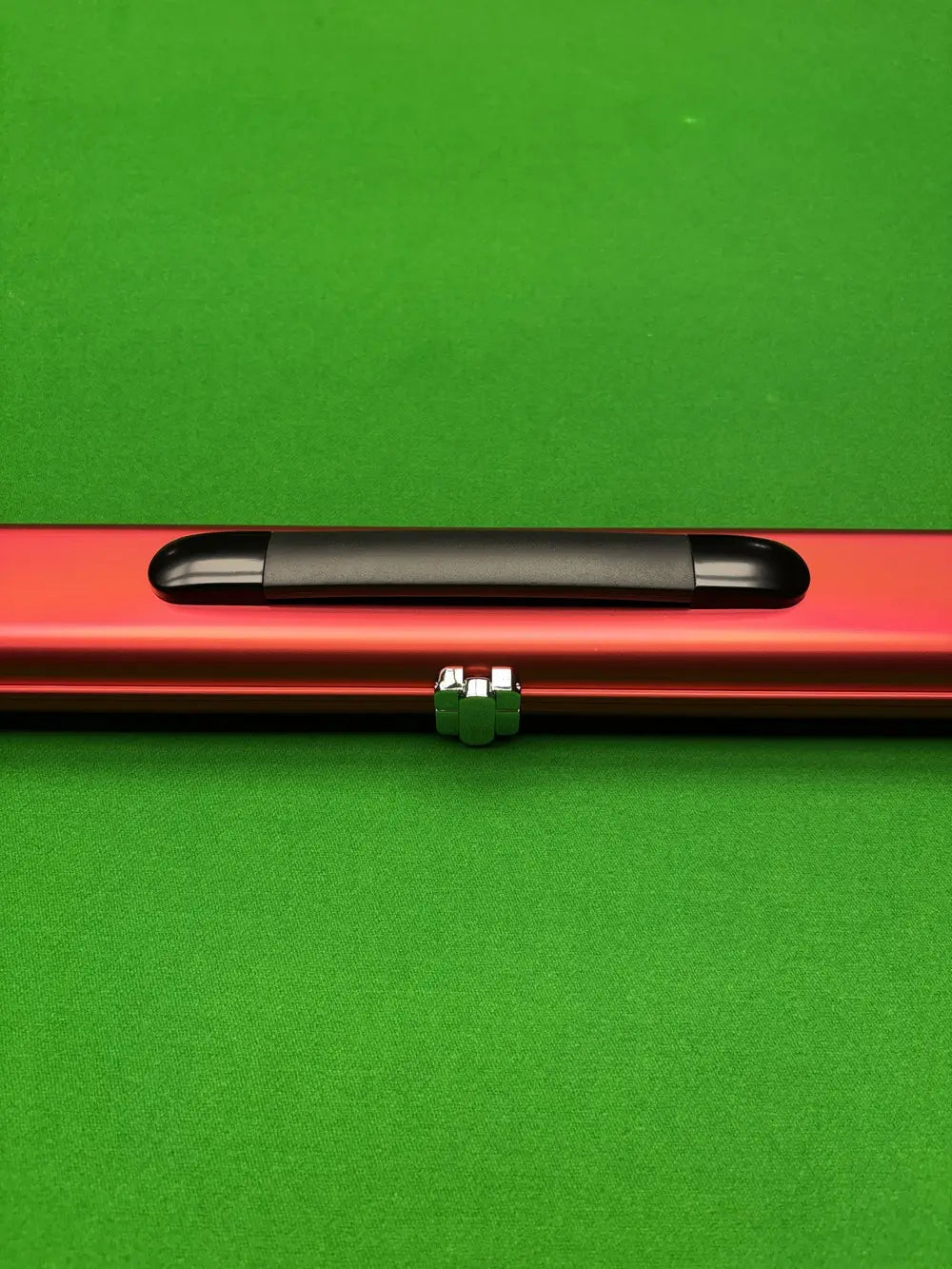 Slimline aluminium snooker cue case in vibrant red, featuring a sleek protective design with secure clasps and lightweight portability
