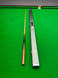 snooker cue and case on a snooker table